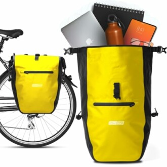 Gele fietstas met laptop en notitieboek